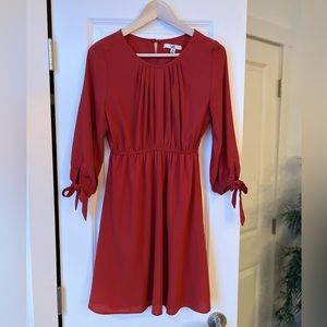 Ya Los Angeles. Size M.. Subtle dark orange 3/4 length bow tie, sleeve dress.